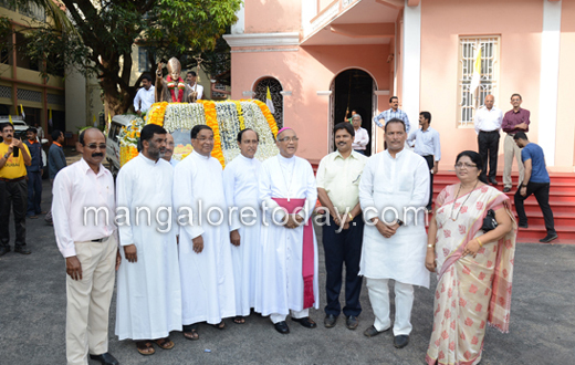 vehicle rally carrying the  statue of Pope John Paul II